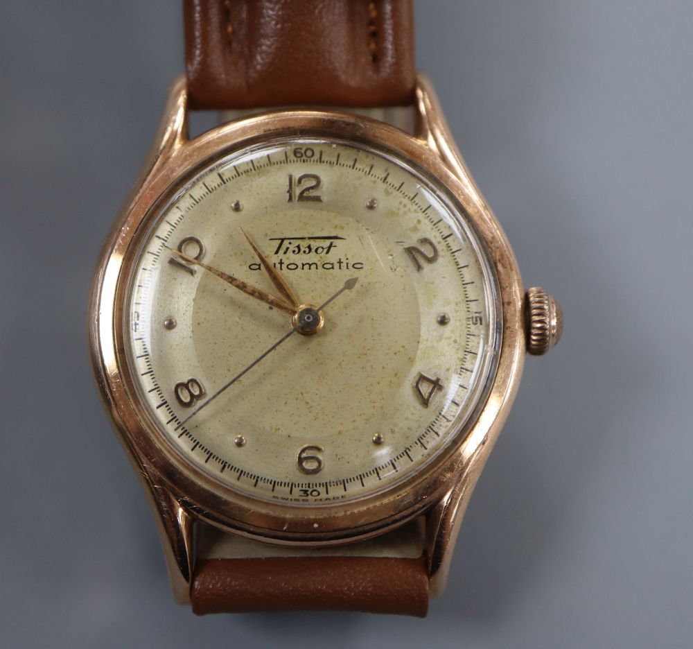 A gentlemans 14k Tissot automatic wrist watch, movement c.28.5.21, on later associated leather strap.